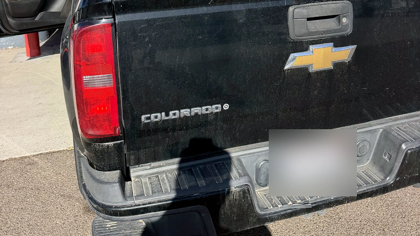 Diesel smog check in San Diego, CA: Chevrolet Colorado pickup with a ladder rack at our F Street station
