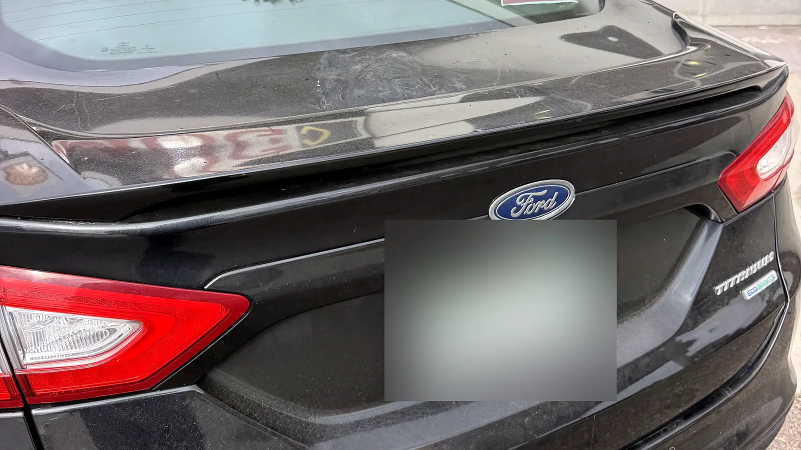 Out-of-state vehicle smog check in San Diego, CA: Ford Fusion with out-of-state plates (blurred) at our station