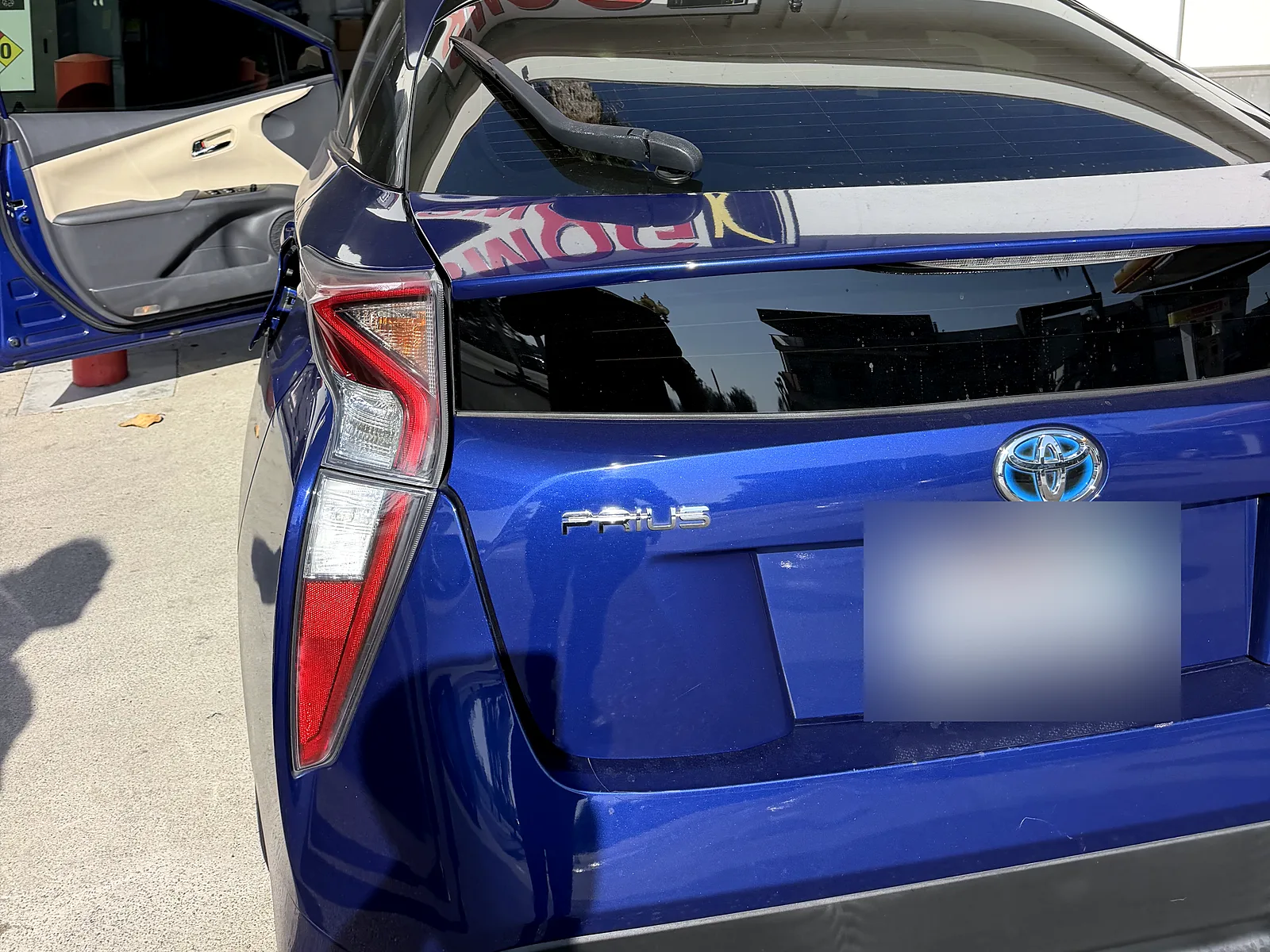 Smog retest in San Diego, CA: blue Toyota Prius at our F Street station