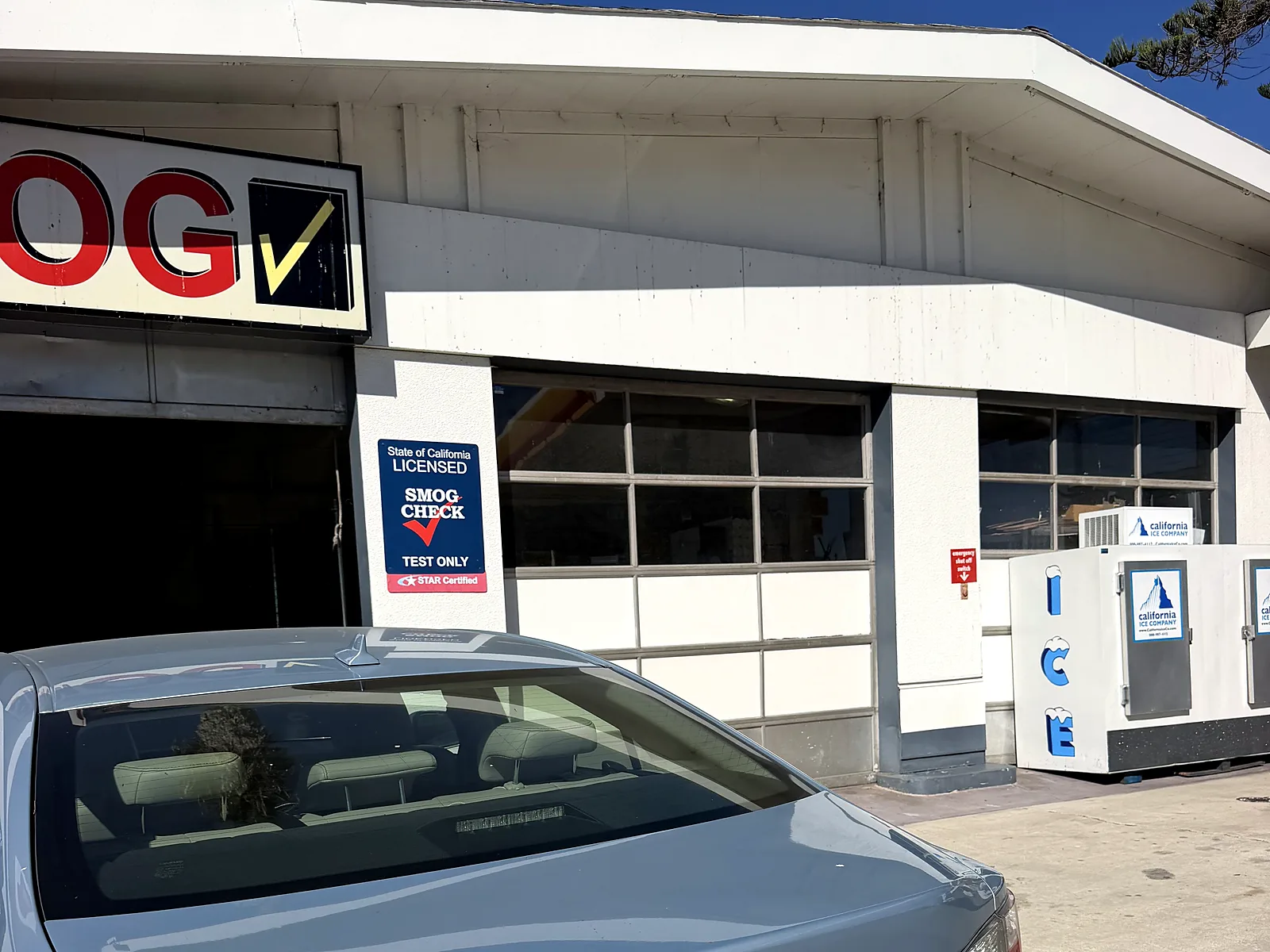 STAR smog check in San Diego, CA: Lexus sedan in front of our station on F Street